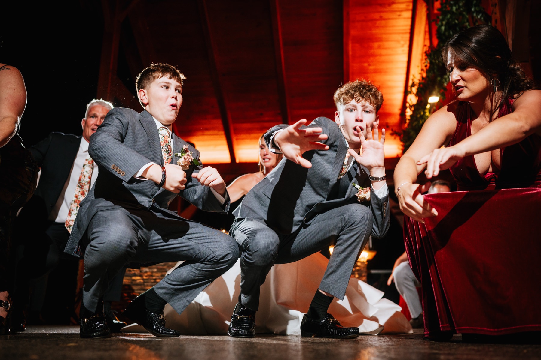 The brides sons getting low on the dancefloor at a Wilderness Lodge Summersville WV wedding.