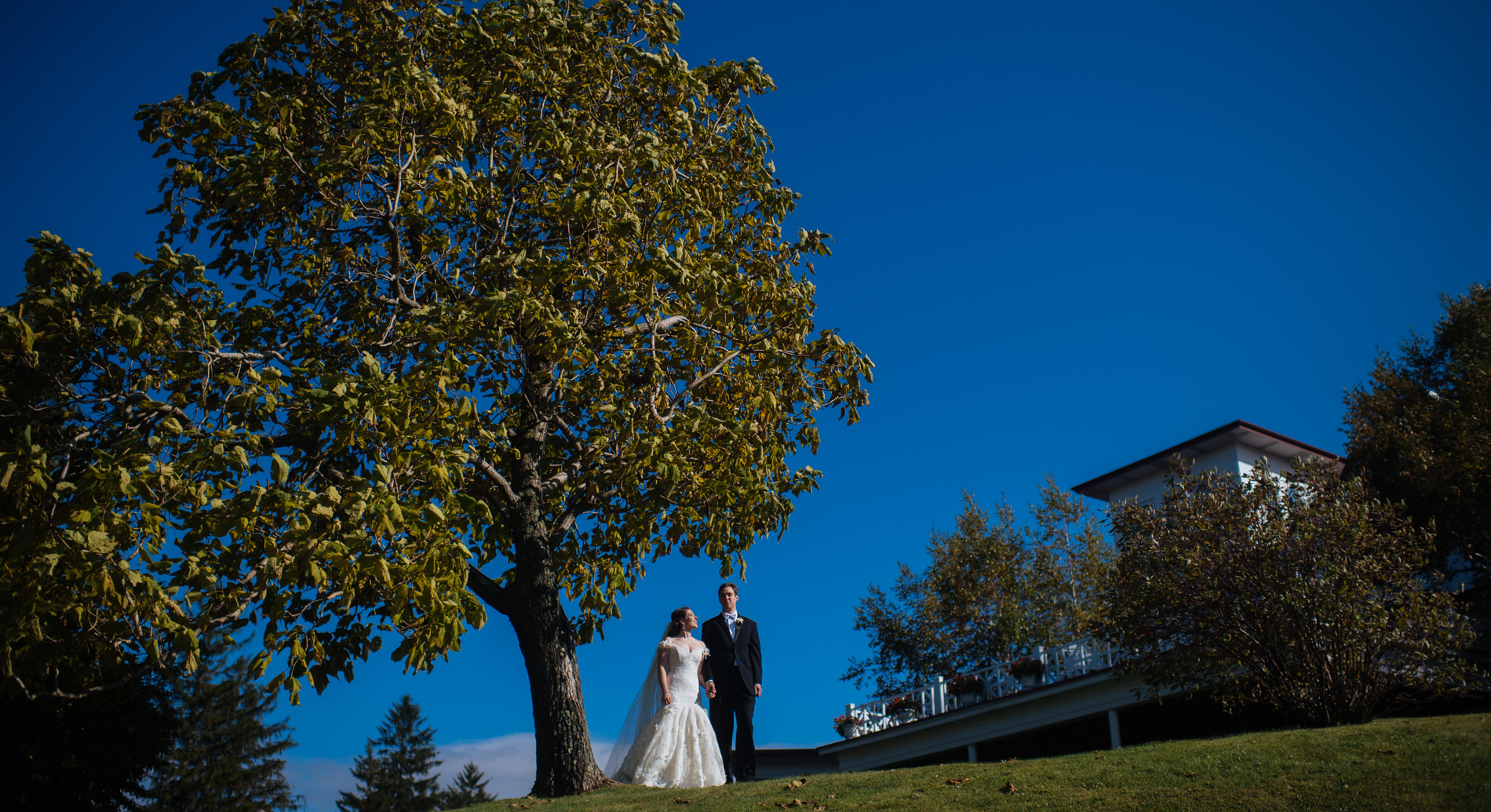 bride and groom in front of summit inn farmington pennsylvania