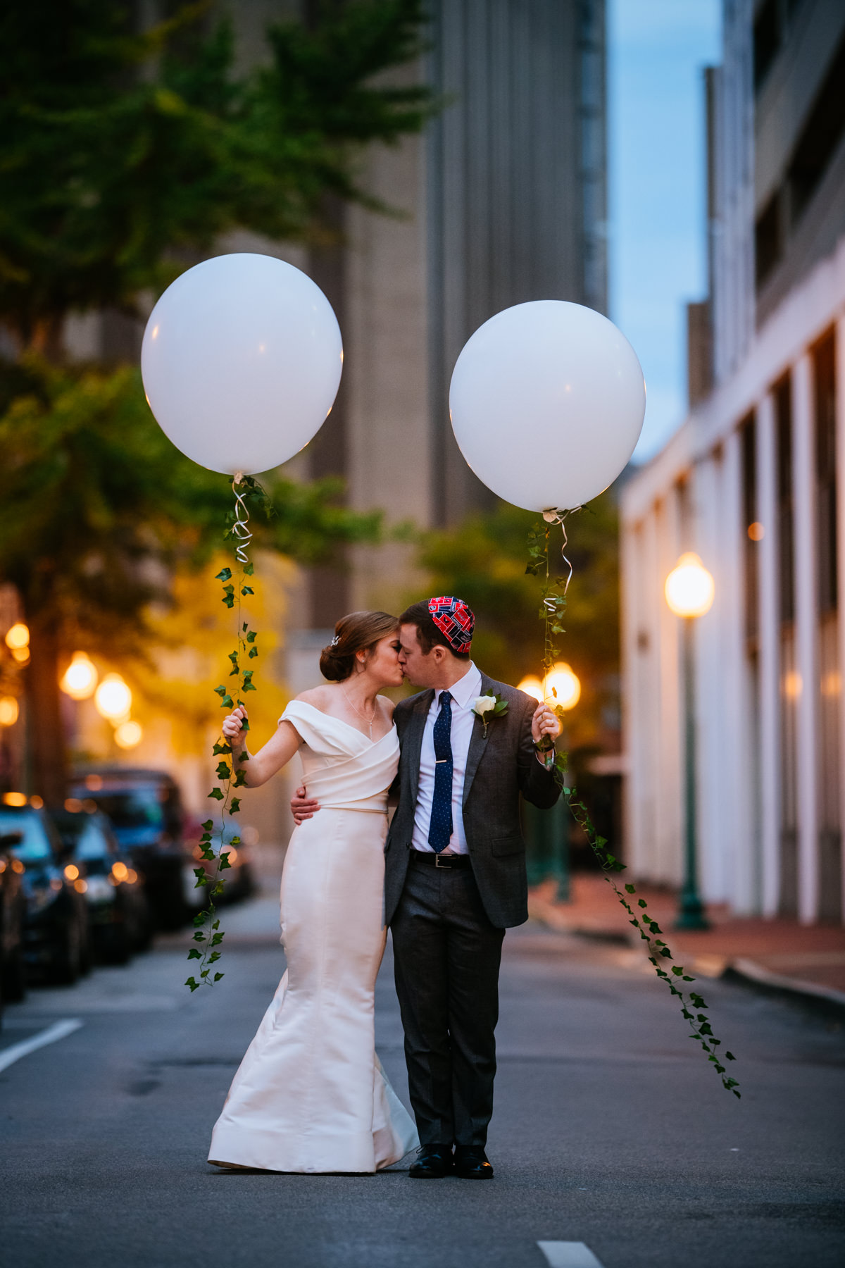 bride and groom with balloons