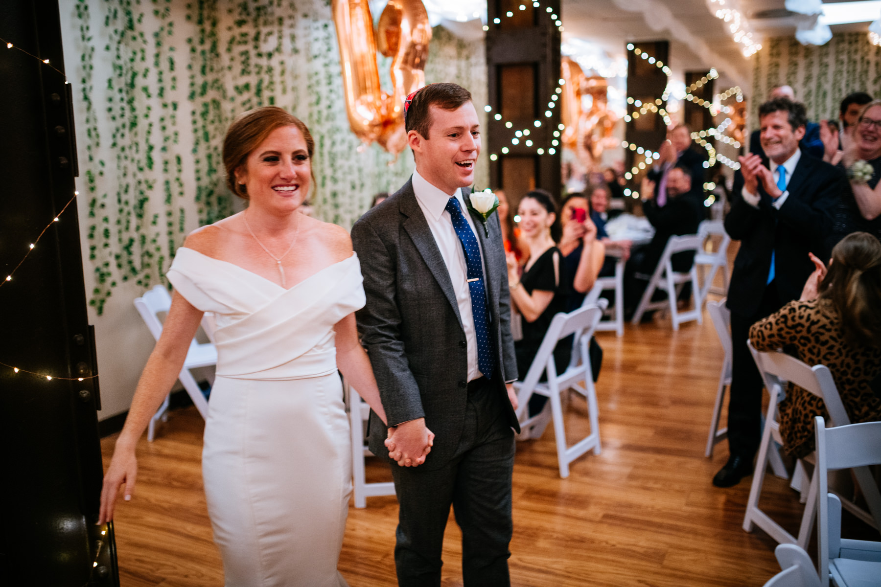 bride and groom enter reception