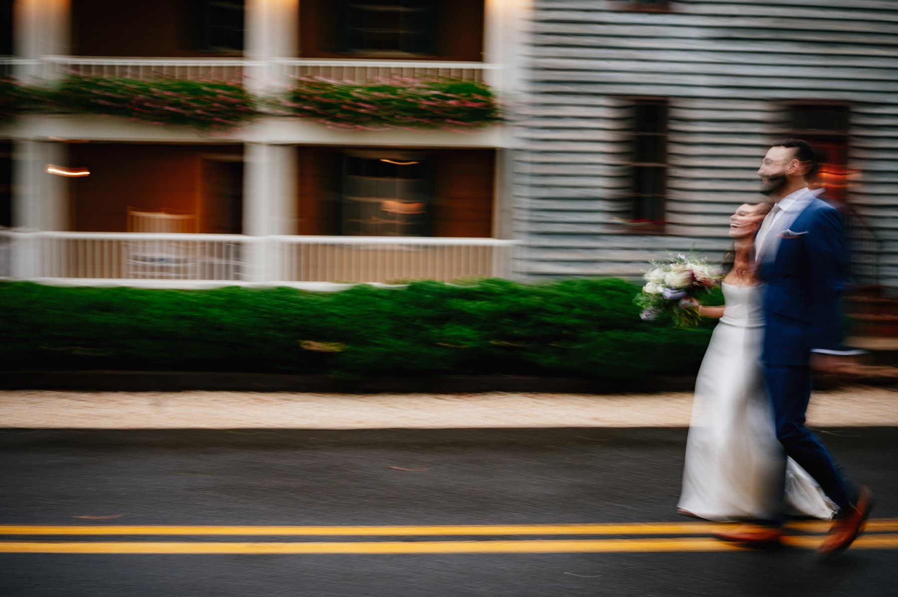 bride and groom walking in street motion blur 
