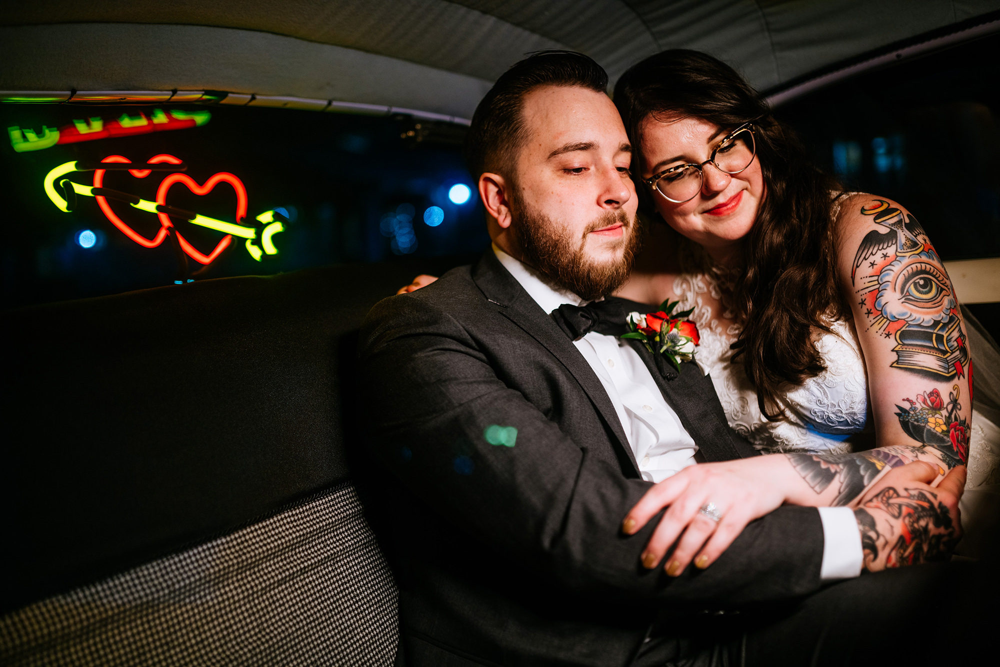 bride and groom portrait in car