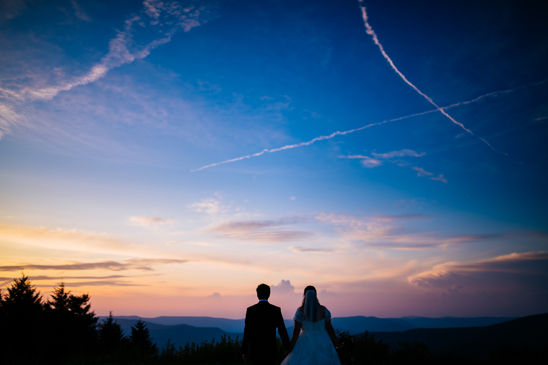bride and groom on mountain 