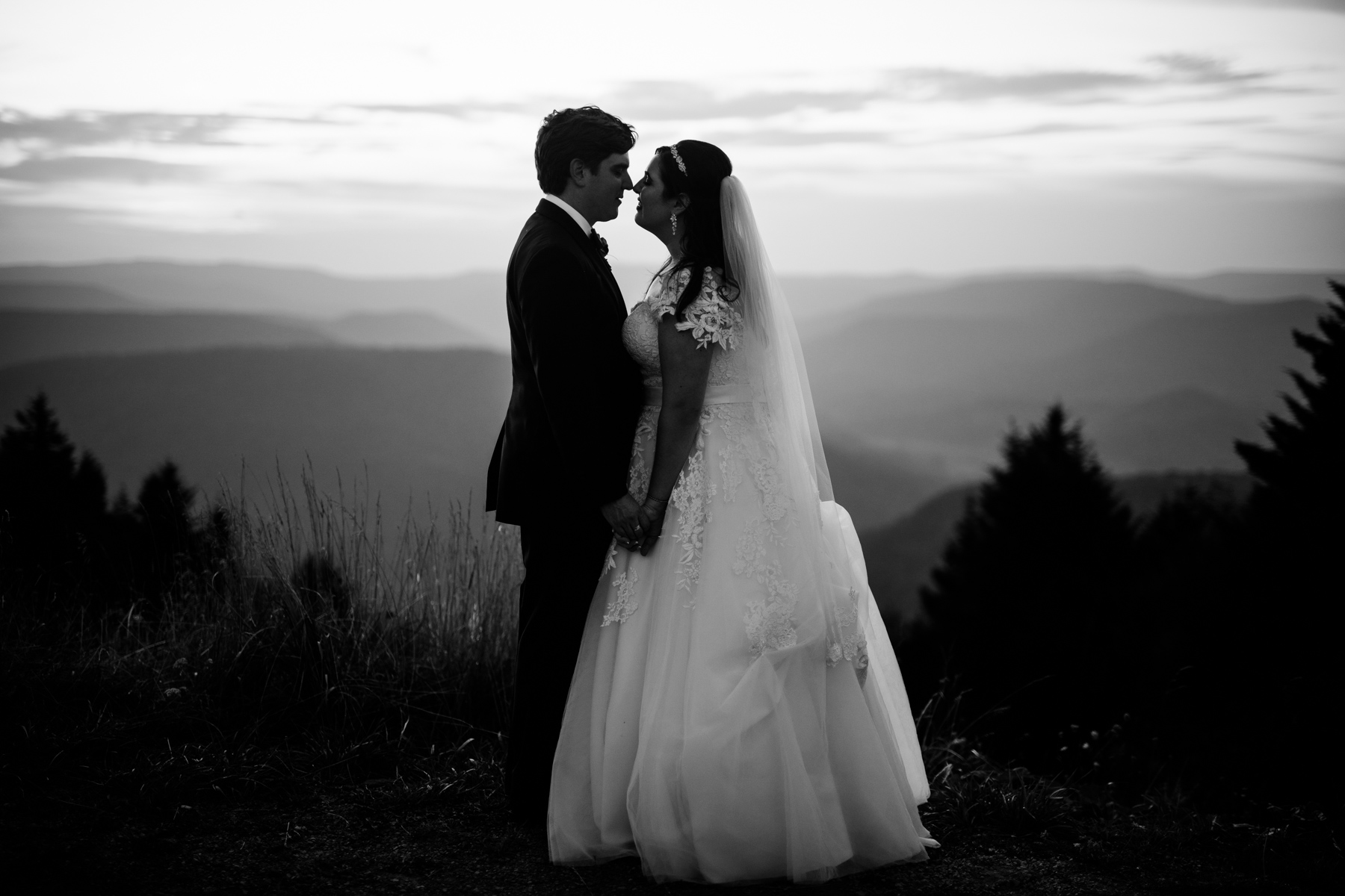 black and white bride and groom kissing allegheny mountains