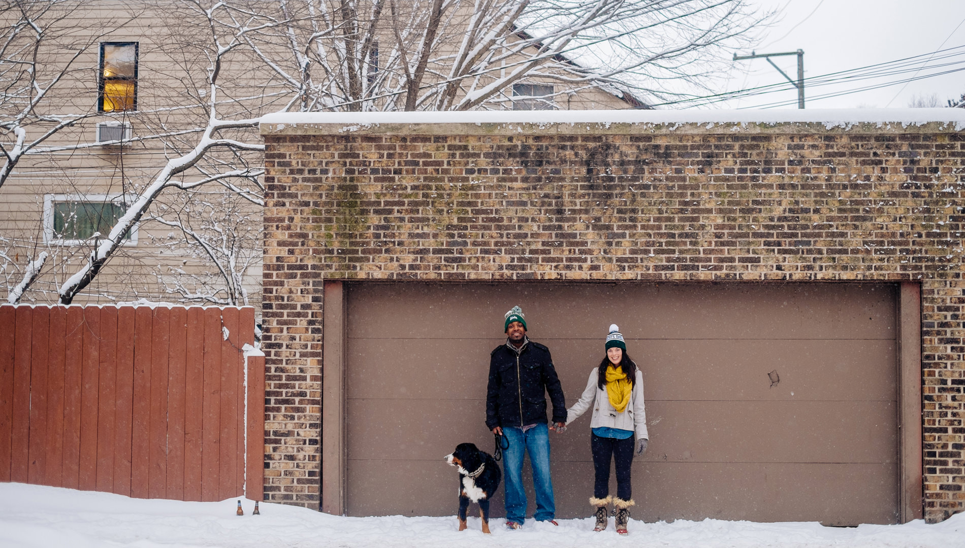 snowy engagement pics with bernese mountain dog in chicago 