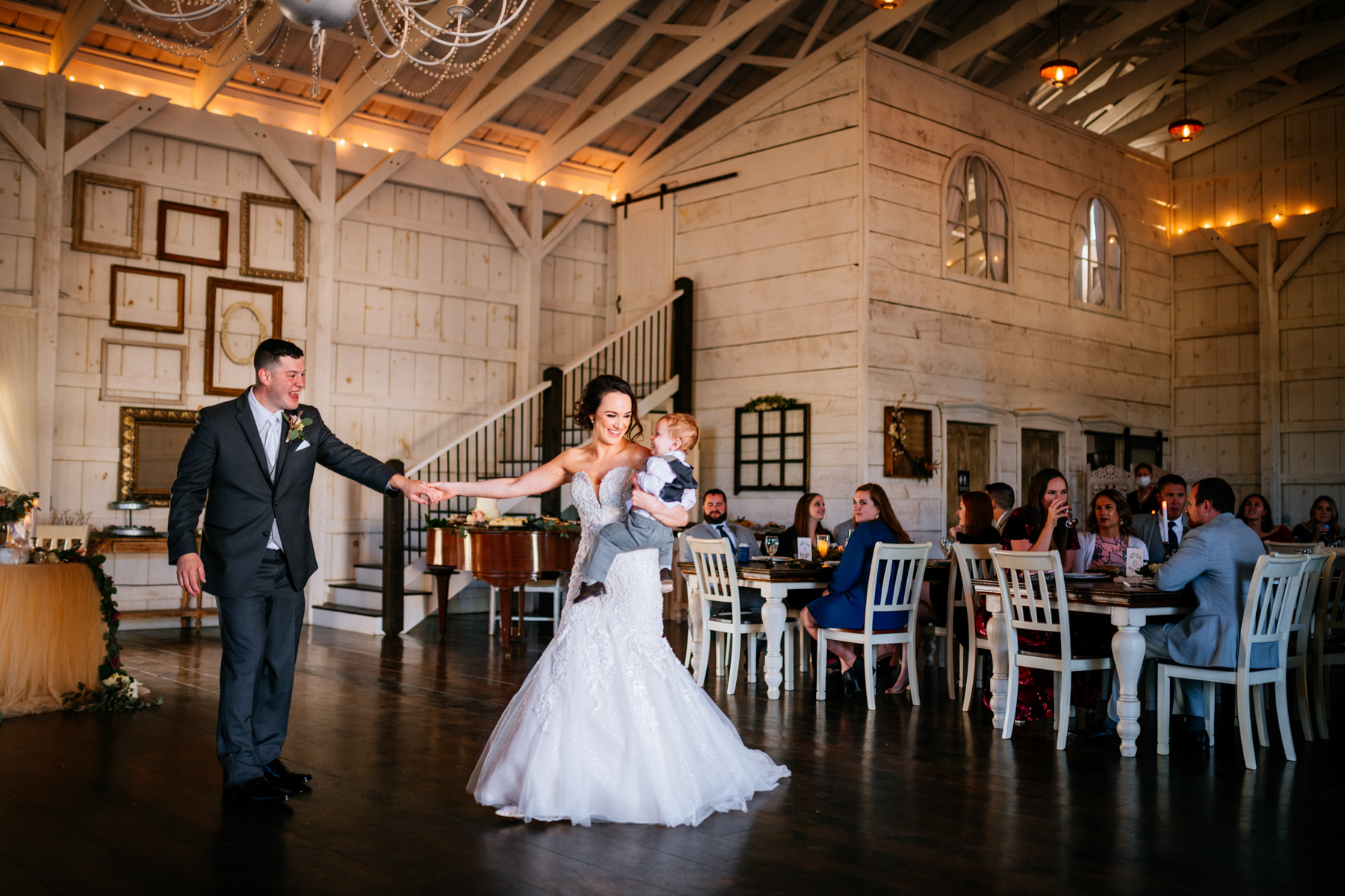 bride and groom dancing with son