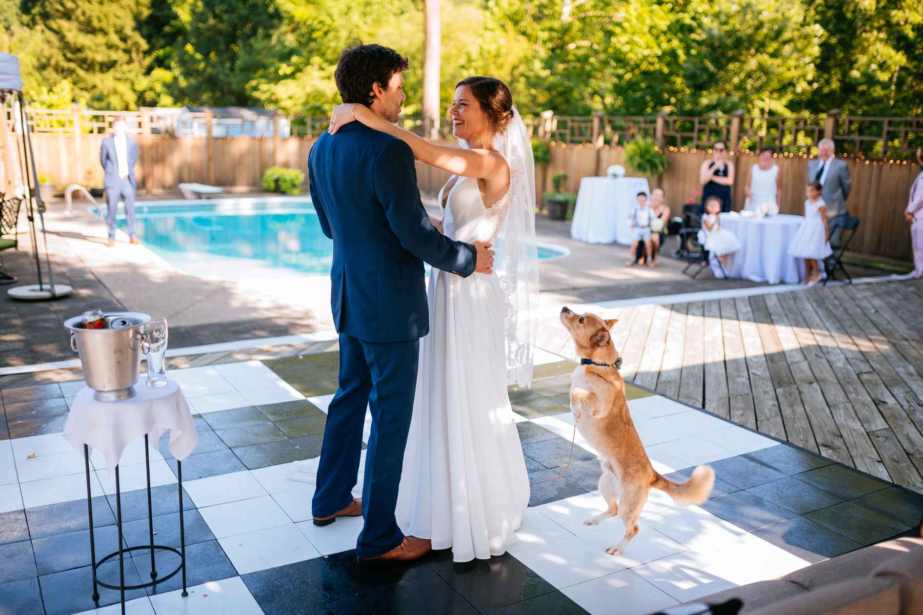 bride and groom first dance with dog